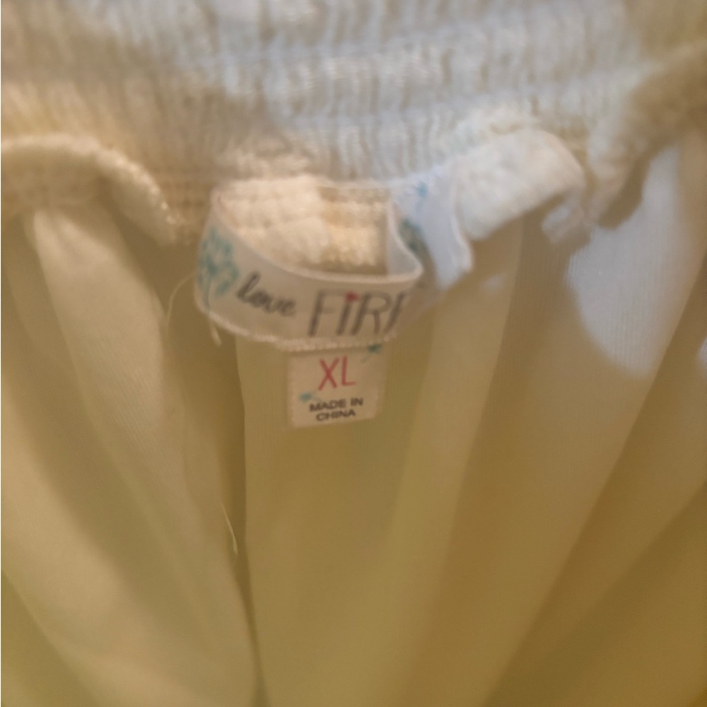 Cream colored women’s dress